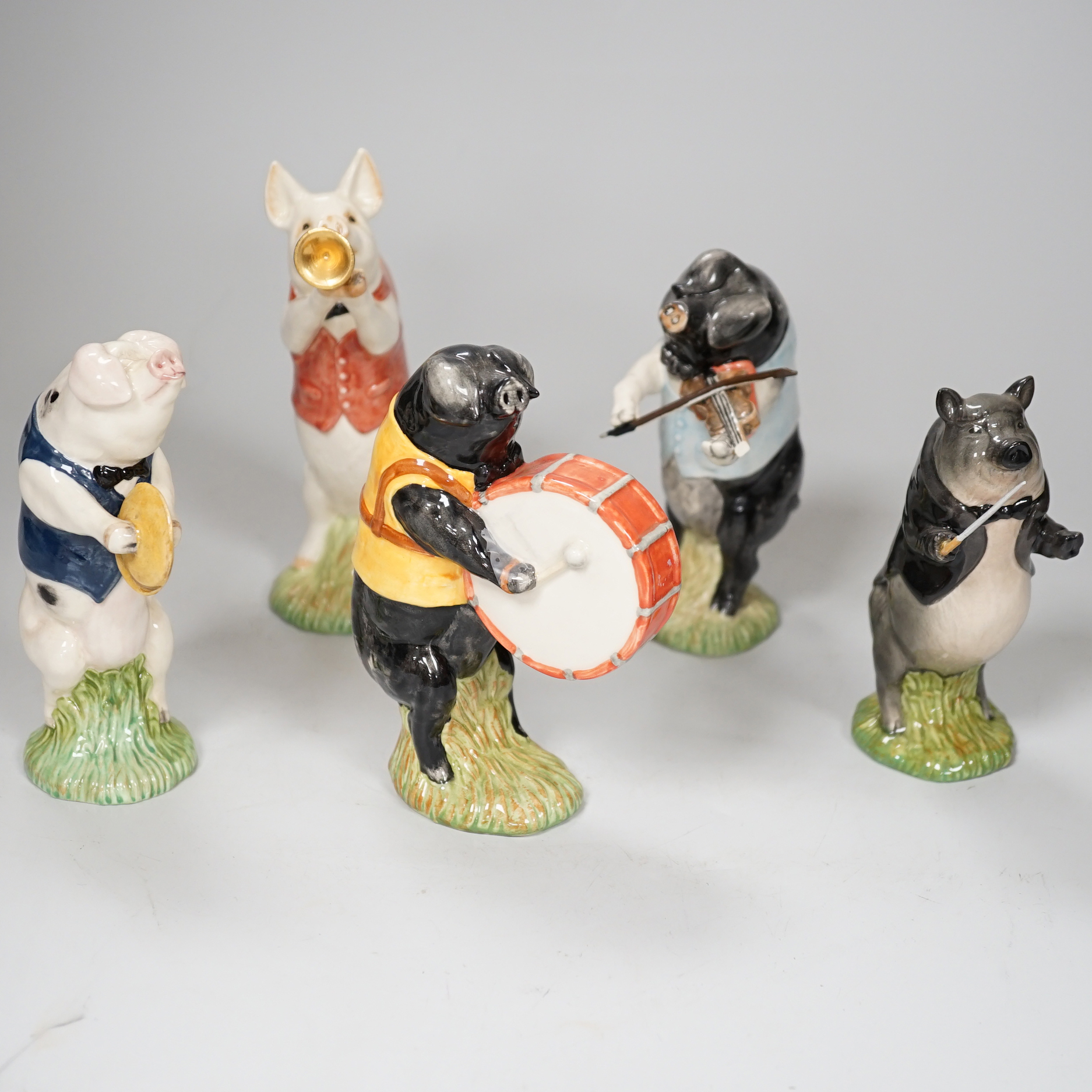 A Beswick five piece pig band, 15cm